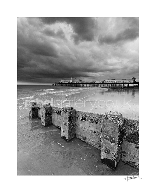 Photograph of Hastings Pier with storm clouds by Hastings Photographer Jon "Huldrick' Wilhelm.