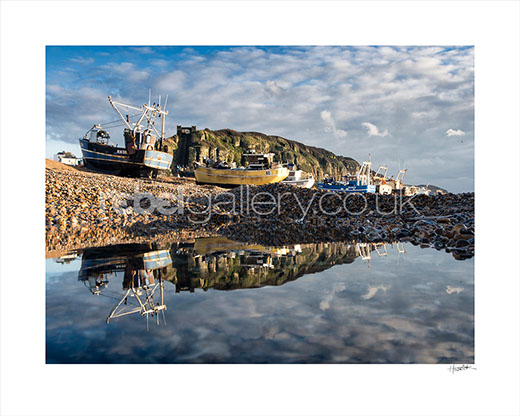 Photo of Trawlers on Hastings Stade reflected in water by Hastings photographer Jon Huldrick Wilhelm.
