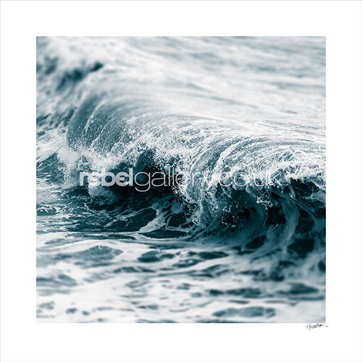 Abstract photograph of a blue tinted wave by photographer Jon Wilhelm.